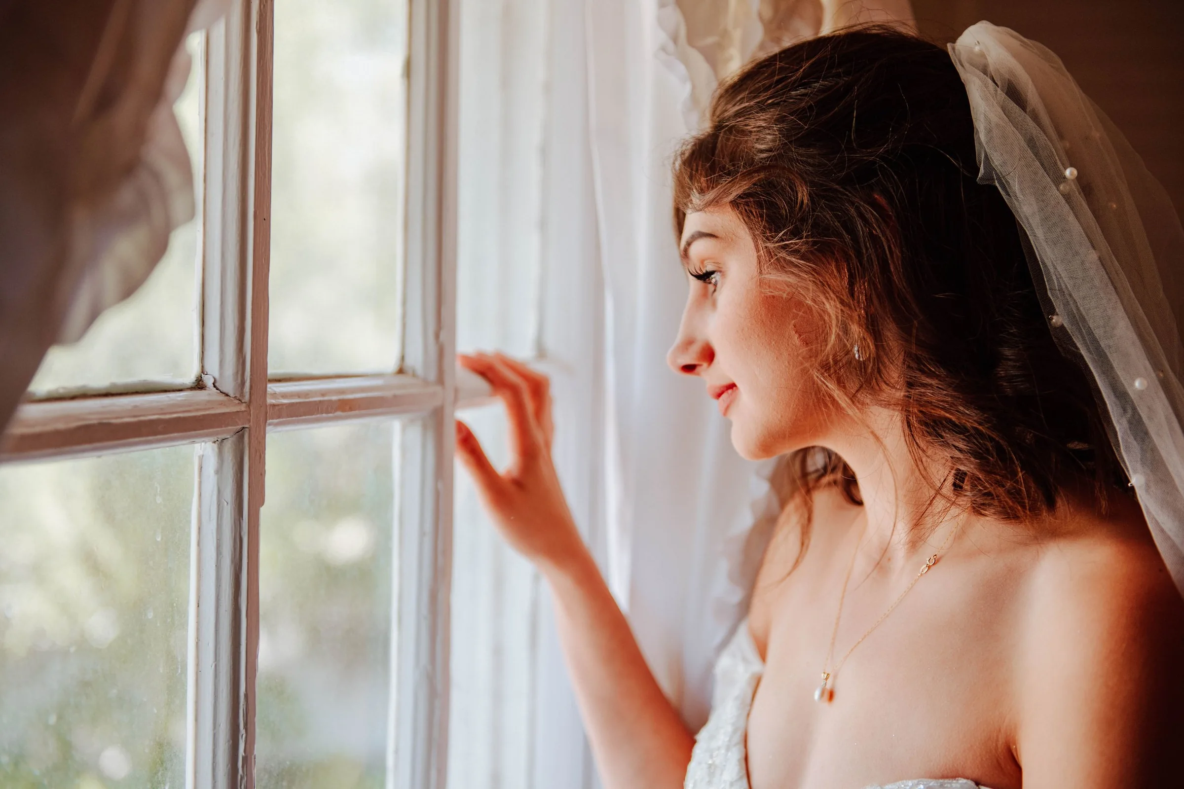 Bride by the window in natural light