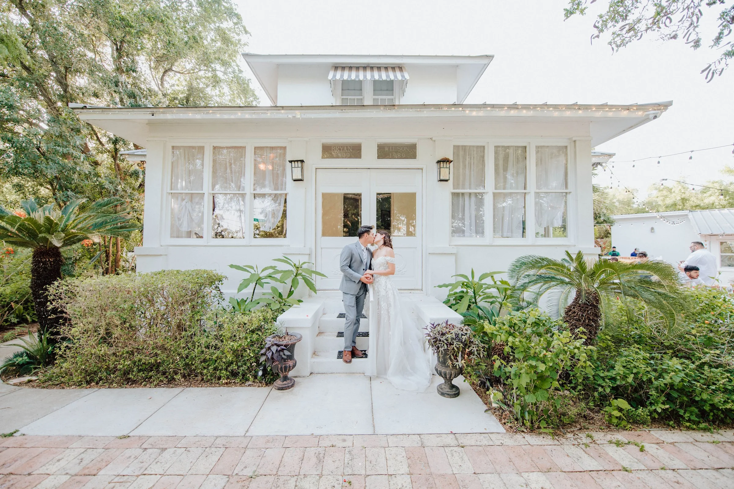 Sidney and Omar portrait at the wedding venue entrance